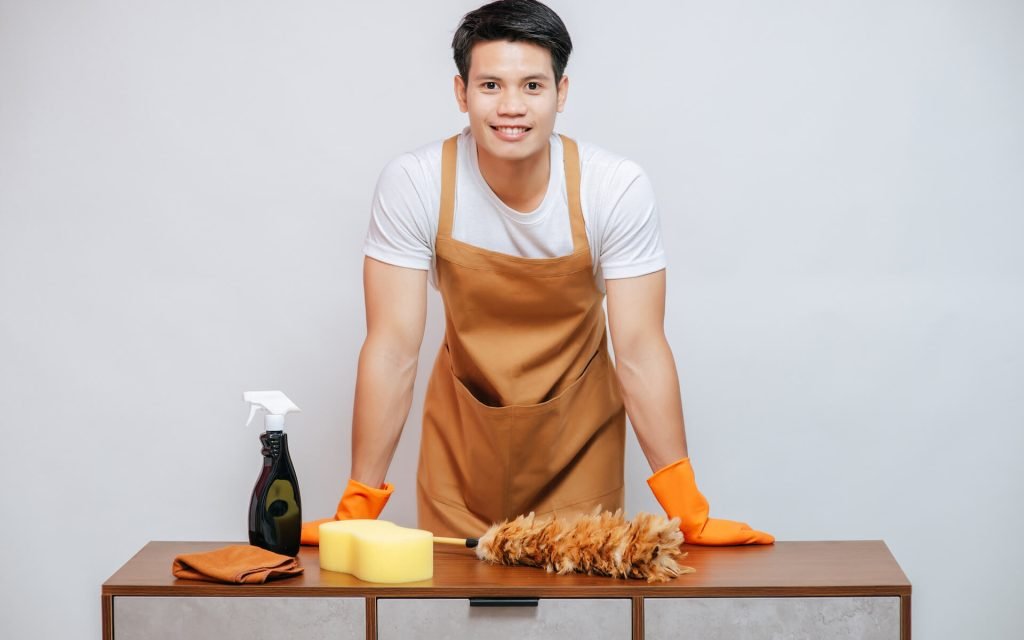 young-man-and-cleaning-equipment-on-furniture-at-h-2021-09-04-01-59-24-utc.jpg